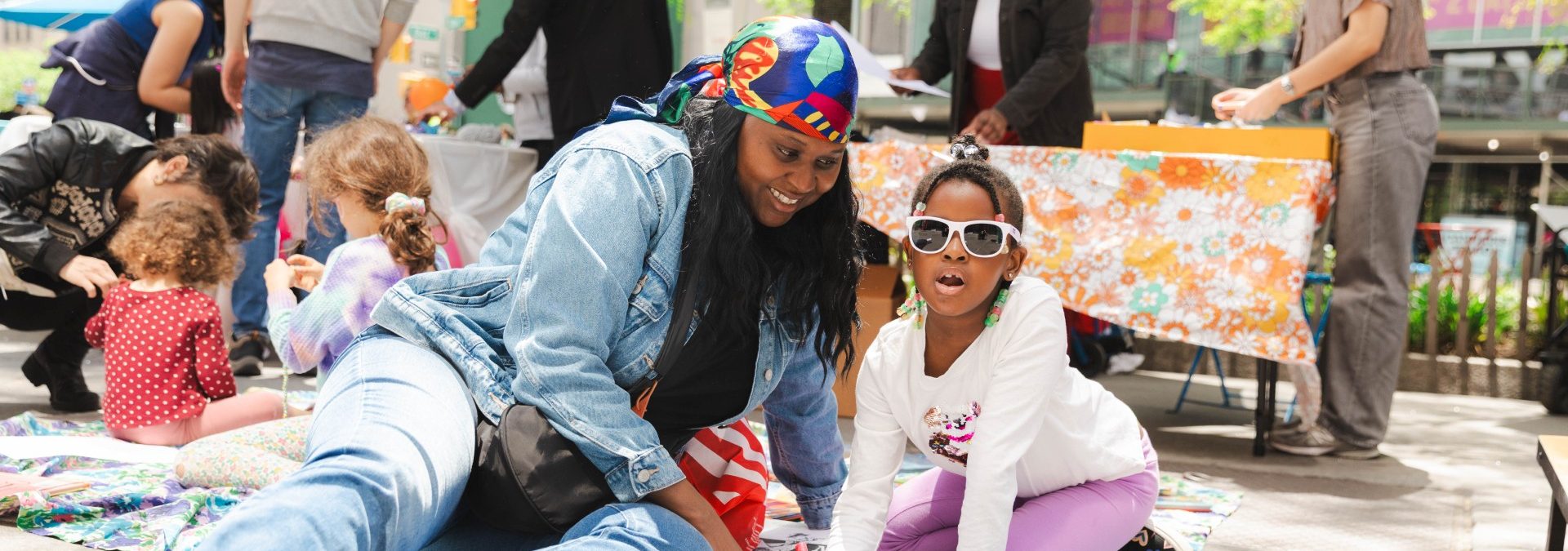 A mother and daughter make crafts