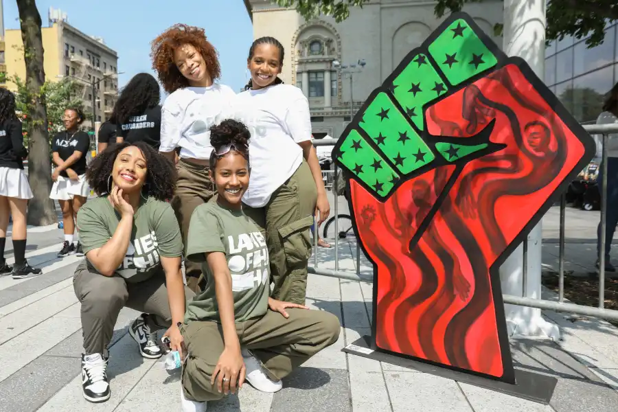 A group of women pose for Juneteenth