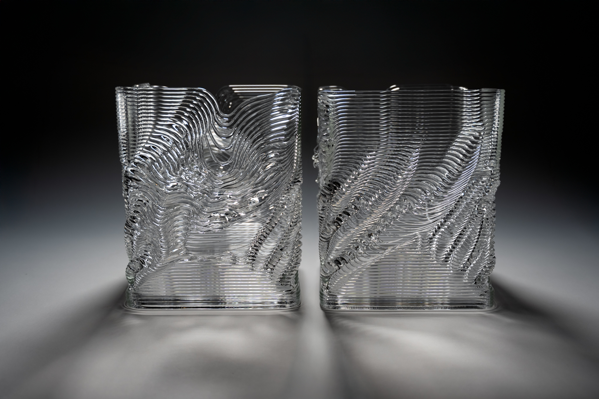 Two glass cups created by artist Michael Stern